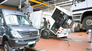 Lorrys and minibus being serviced